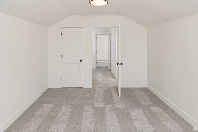 612 North 400 West Logan, UT 84321 - Photo 27 of 27 Carpeted room featuring a ceiling-mounted light fixture, white walls, and bright white trim