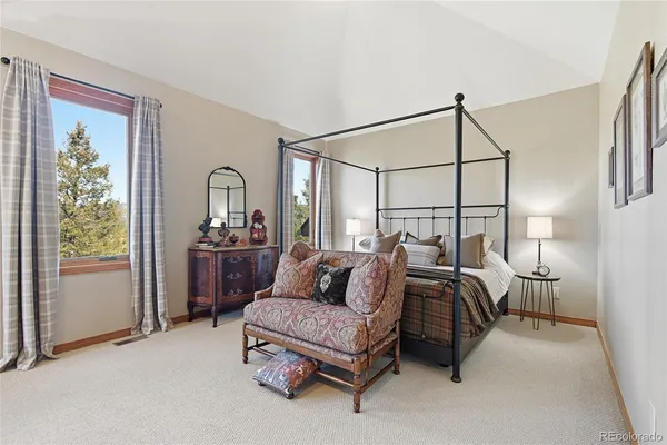 a bedroom with furniture and a window