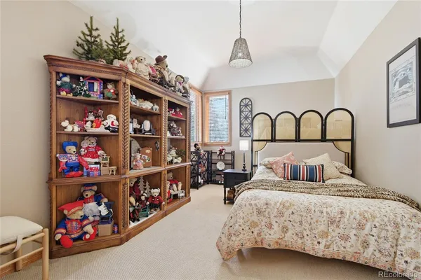 a bedroom with a bed dresser and a window