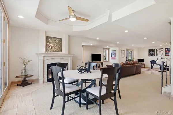a view of a dining room with furniture and a fireplace