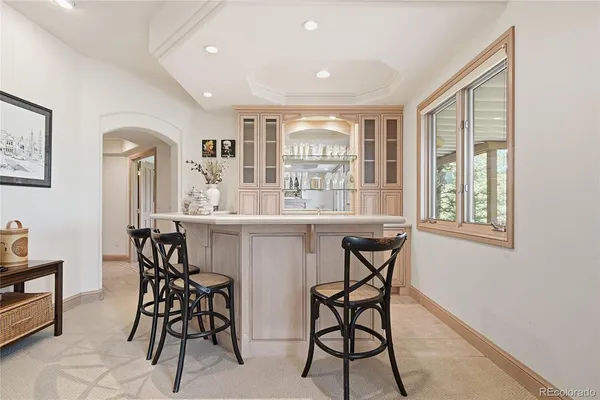 a dining room with furniture and window