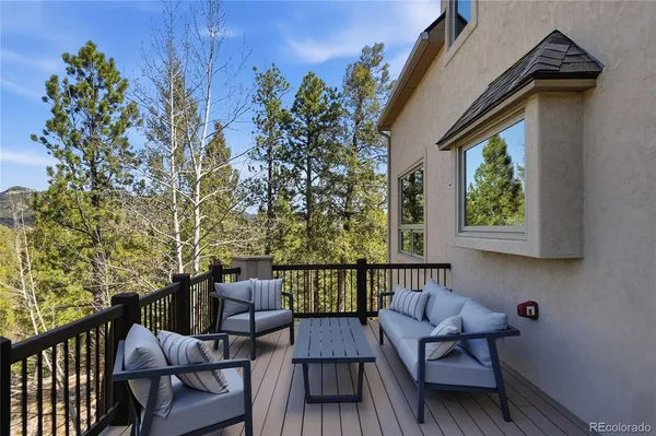a view of a two chairs in the balcony