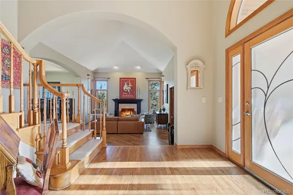 a view of entryway and hall with dining room