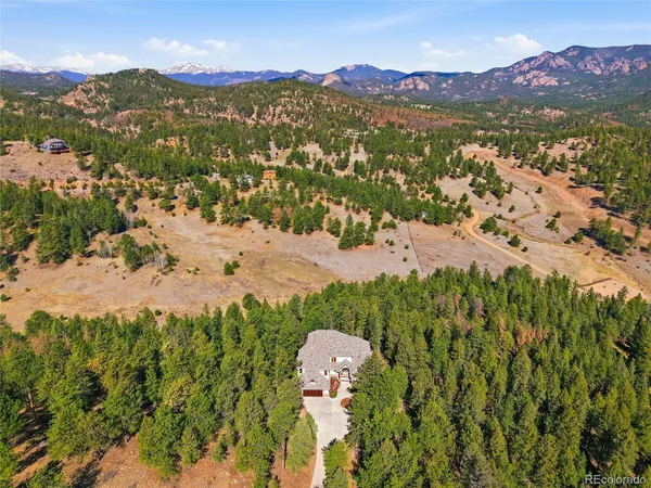 a view of a mountain with a lake in the background