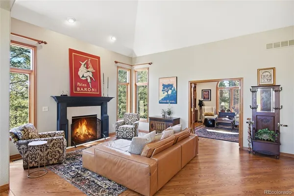 a living room with furniture and a fireplace