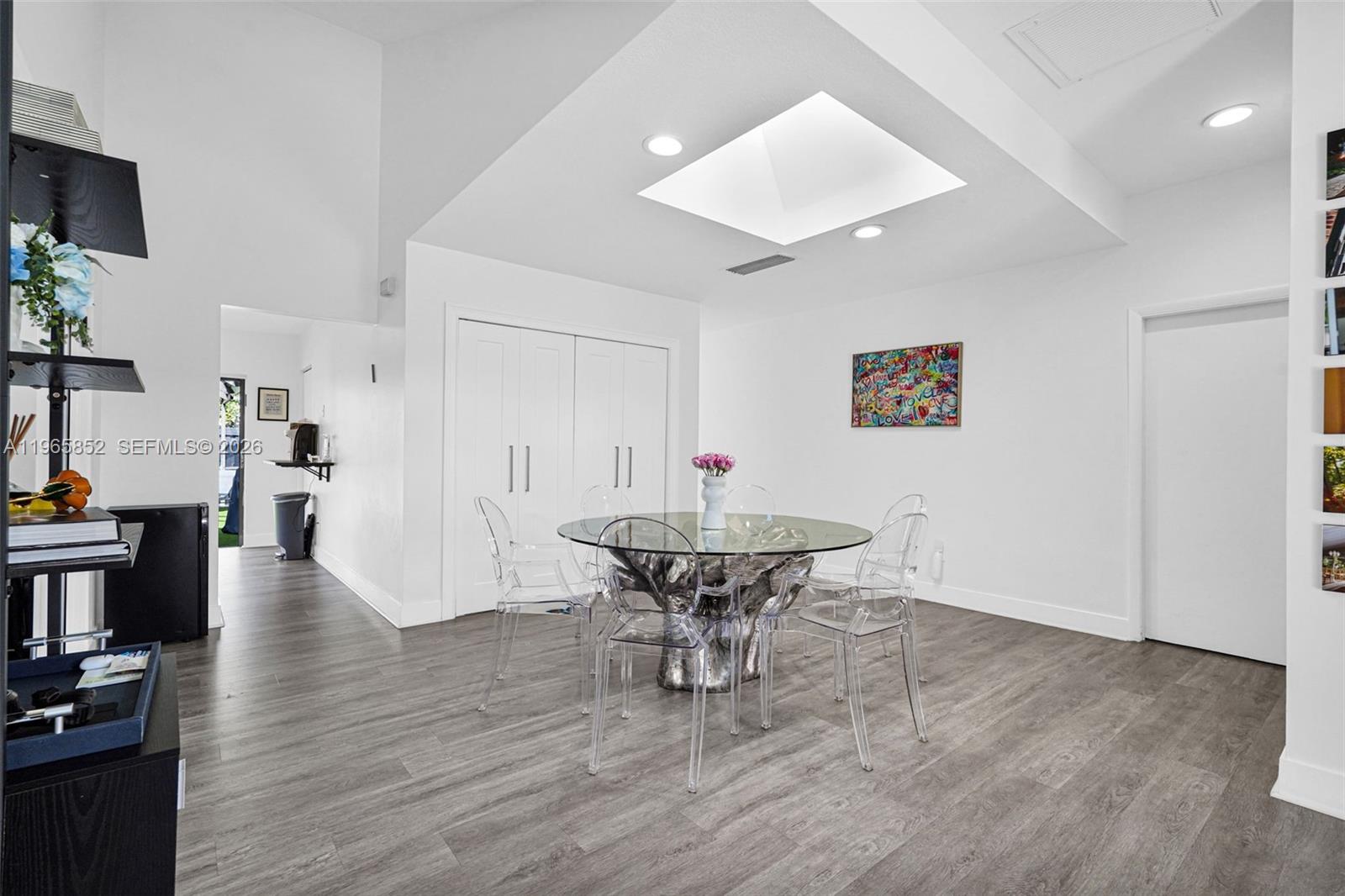 7635 Sierra Terrace West Boca Raton, FL 33433 - Photo 12 of 53 a view of a dining room with furniture and wooden floor