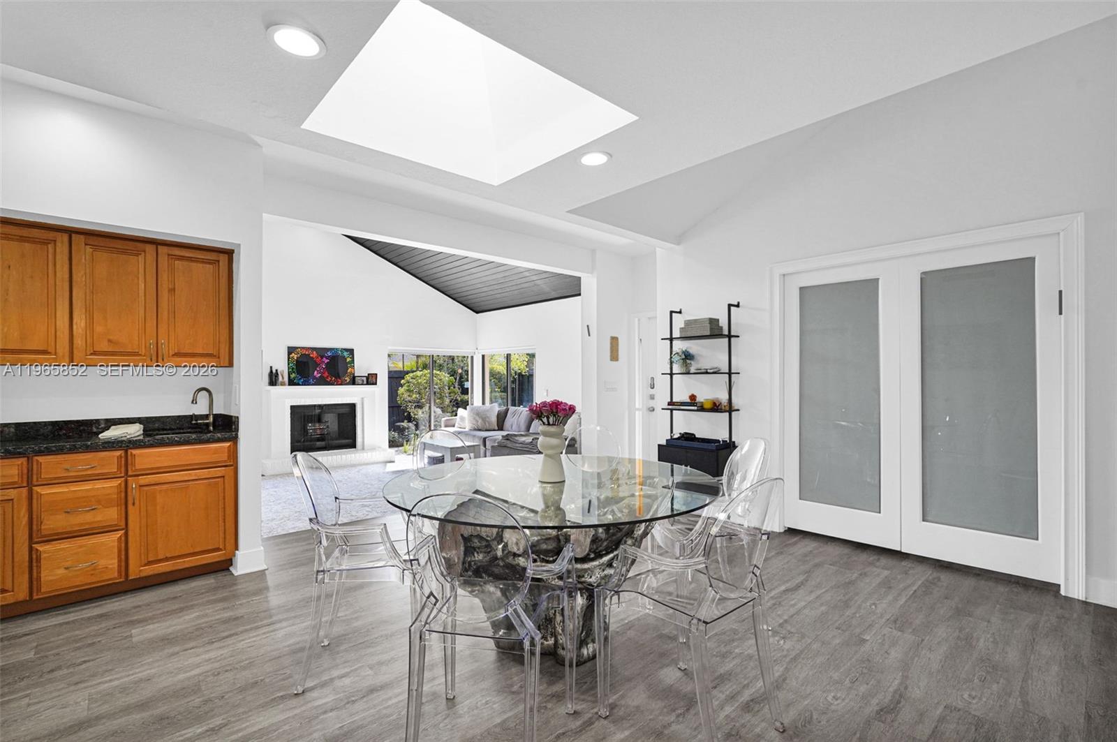7635 Sierra Terrace West Boca Raton, FL 33433 - Photo 13 of 53 a view of a dining room with furniture and wooden floor