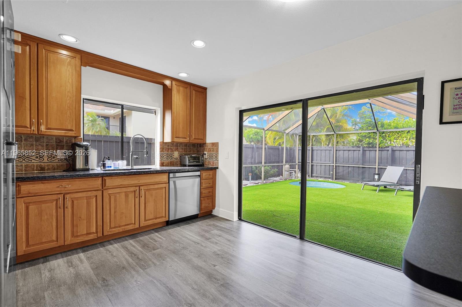 7635 Sierra Terrace West Boca Raton, FL 33433 - Photo 19 of 53 a large kitchen with a large window and a kitchen view