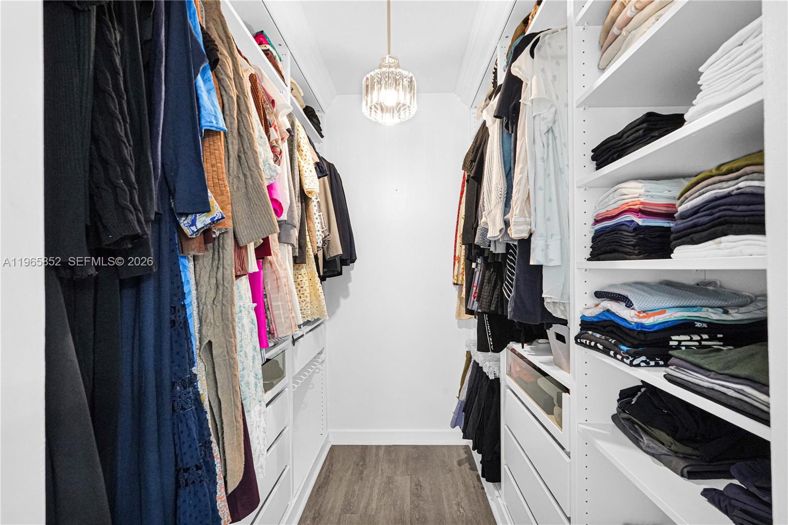 7635 Sierra Terrace West Boca Raton, FL 33433 - Photo 25 of 53 a view of walk in closet with clothes and shoes