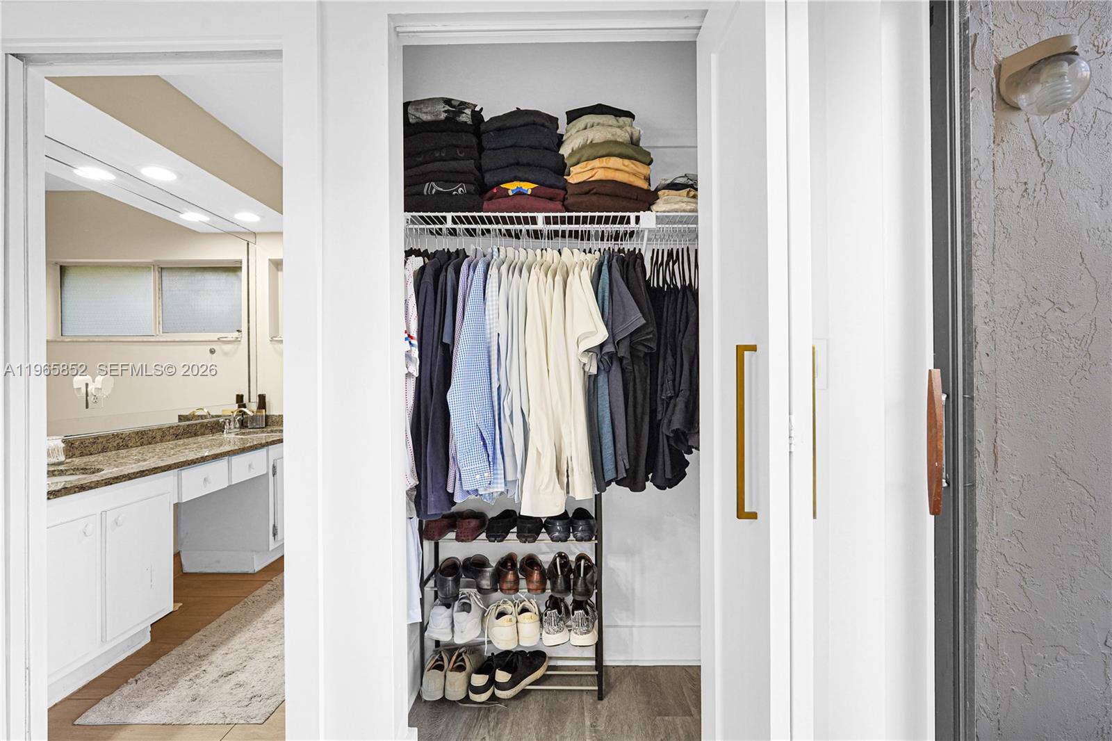 7635 Sierra Terrace West Boca Raton, FL 33433 - Photo 26 of 53 a view of walk in closet with clothes and shoes