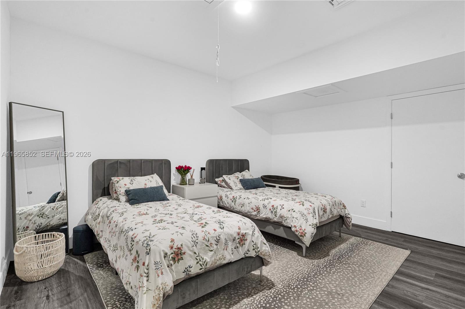 7635 Sierra Terrace West Boca Raton, FL 33433 - Photo 27 of 53 a bedroom with two beds and wooden floor