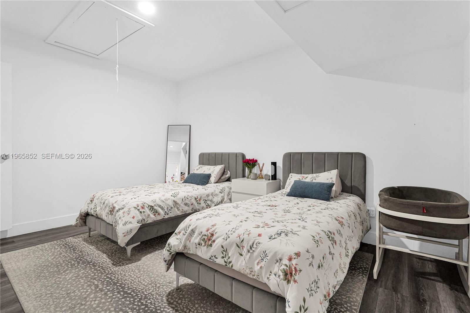 7635 Sierra Terrace West Boca Raton, FL 33433 - Photo 28 of 53 a bedroom with two beds and a lamp