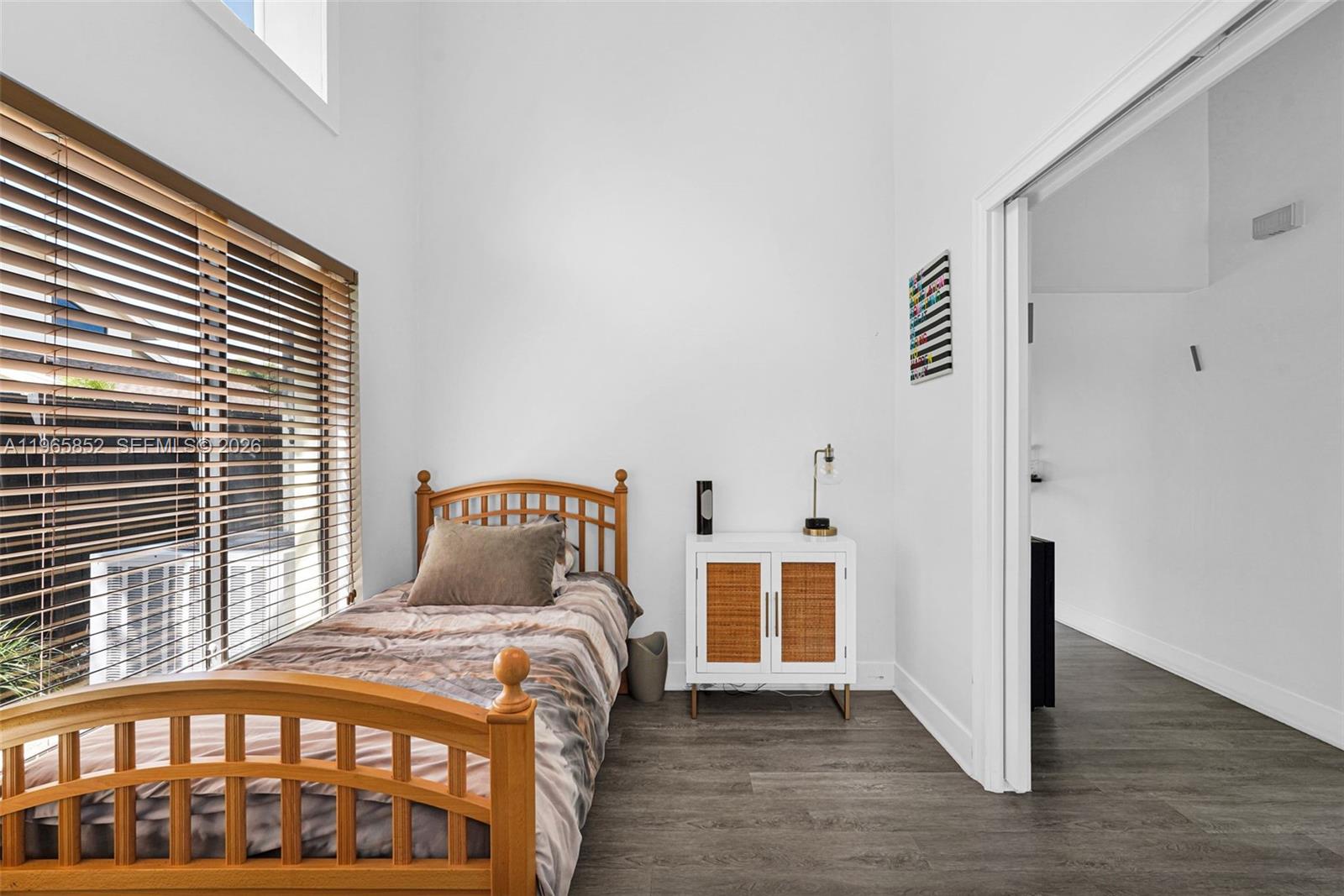 7635 Sierra Terrace West Boca Raton, FL 33433 - Photo 34 of 53 a bedroom with a bed and a window