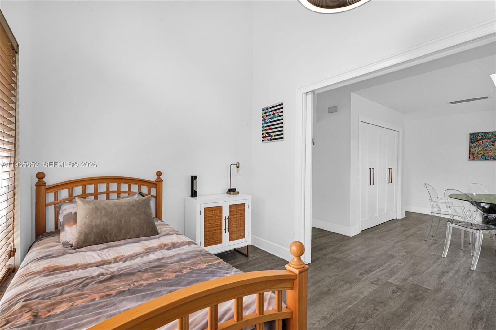 7635 Sierra Terrace West Boca Raton, FL 33433 - Photo 35 of 53 a bedroom with a bed and wooden floor