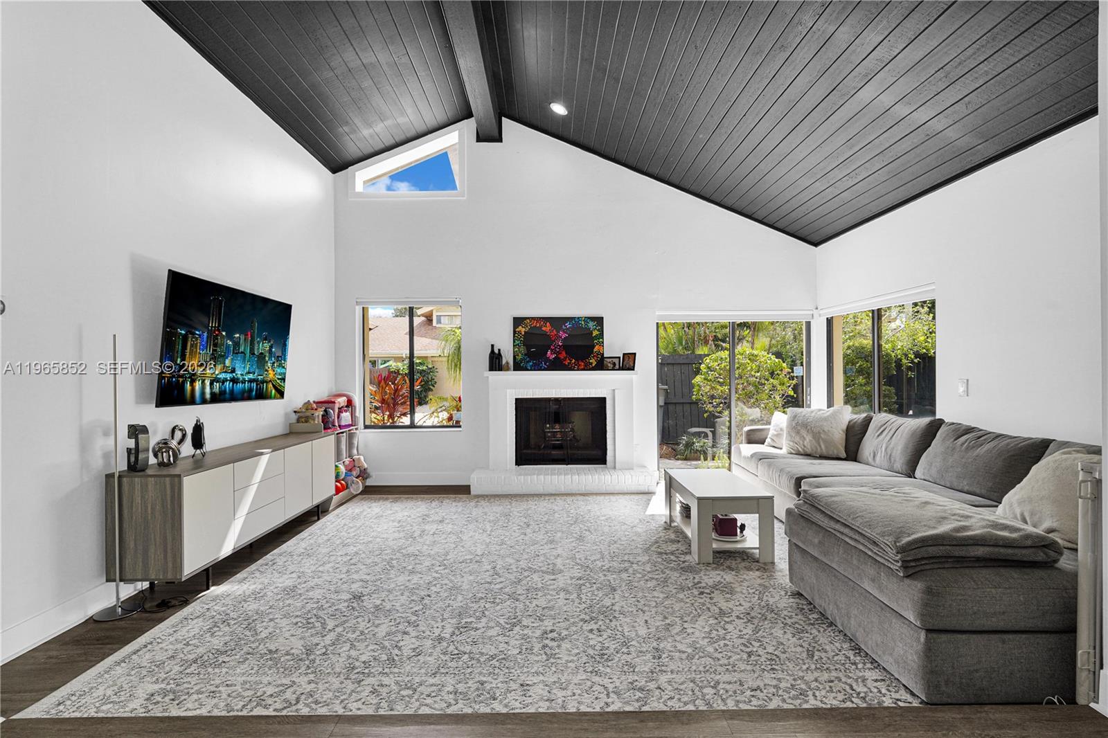 7635 Sierra Terrace West Boca Raton, FL 33433 - Photo 4 of 53 a living room with furniture and a fireplace