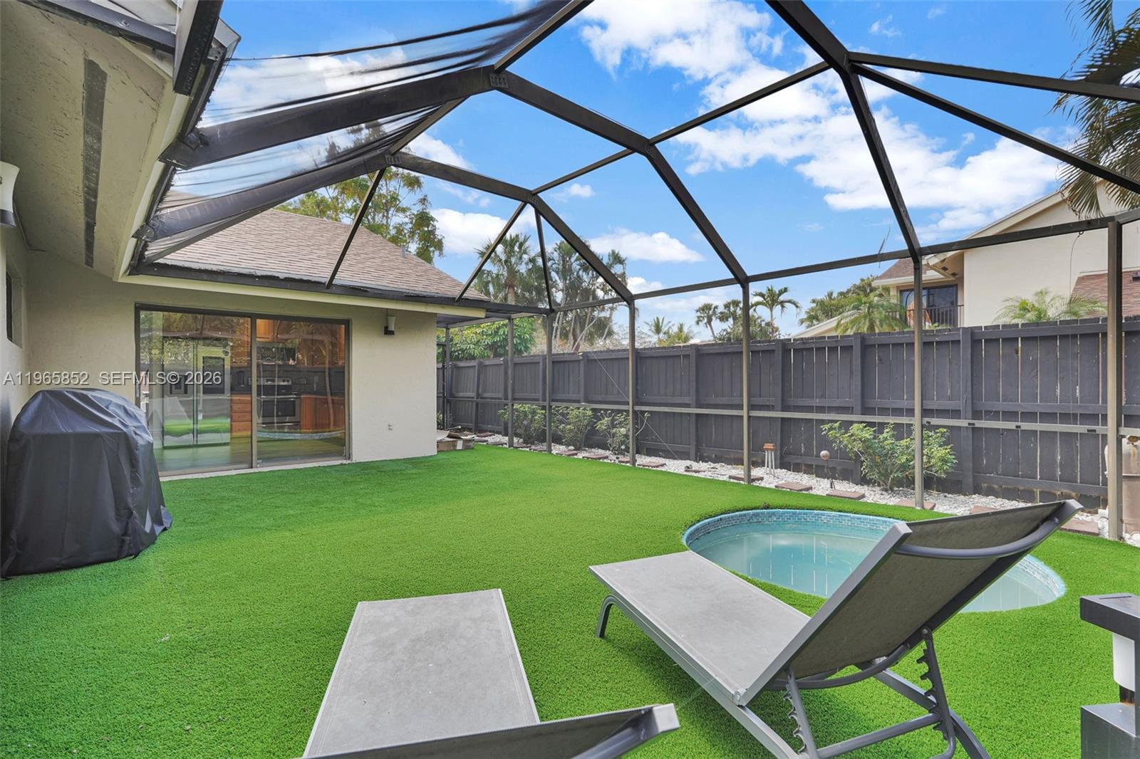 7635 Sierra Terrace West Boca Raton, FL 33433 - Photo 42 of 53 a view of backyard with seating area