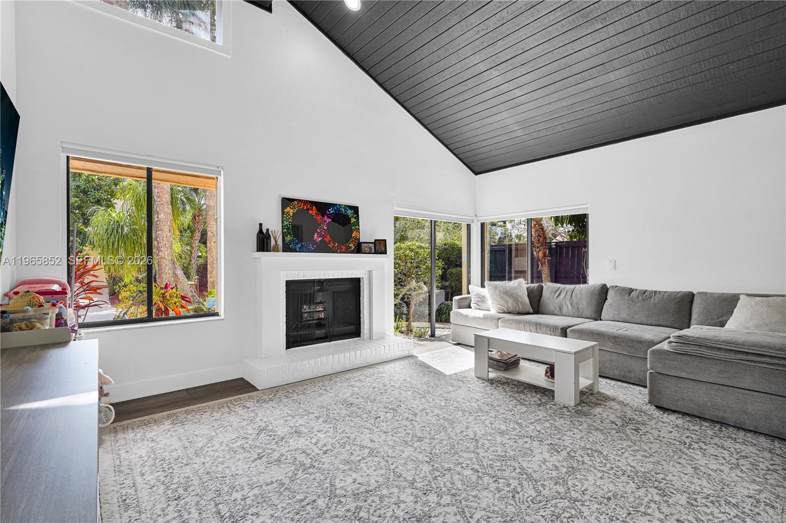 7635 Sierra Terrace West Boca Raton, FL 33433 - Photo 5 of 53 a living room with furniture and a fireplace