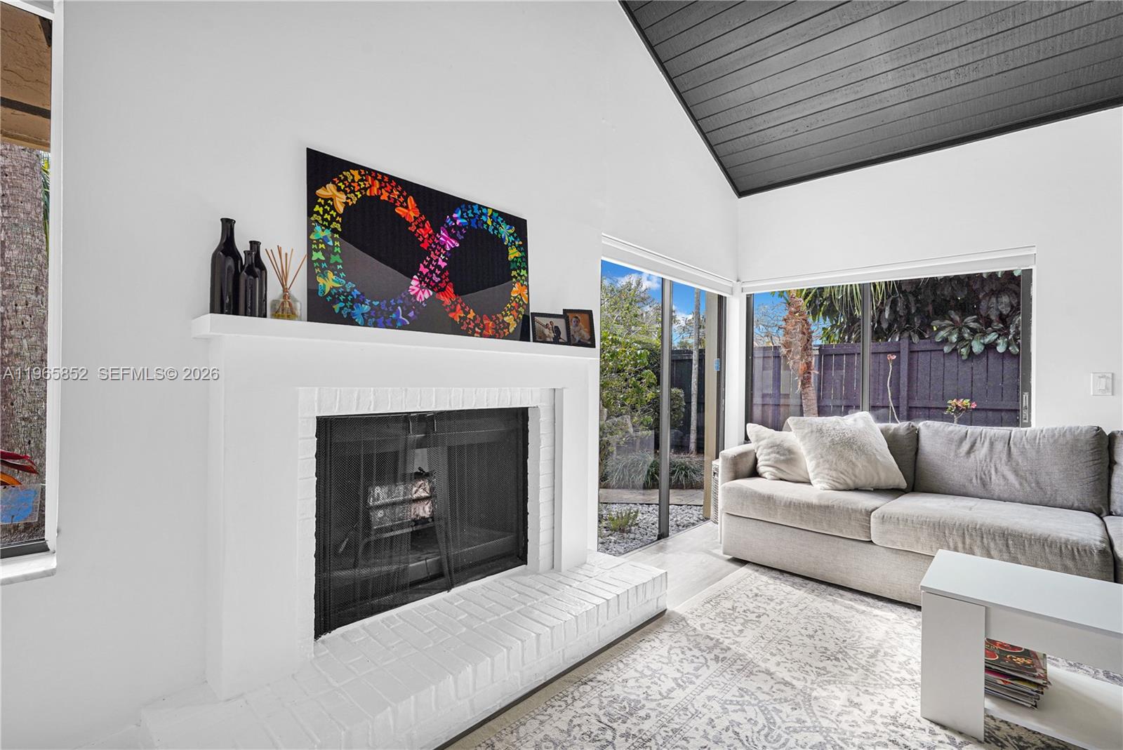 7635 Sierra Terrace West Boca Raton, FL 33433 - Photo 10 of 53 a living room with furniture and a fireplace