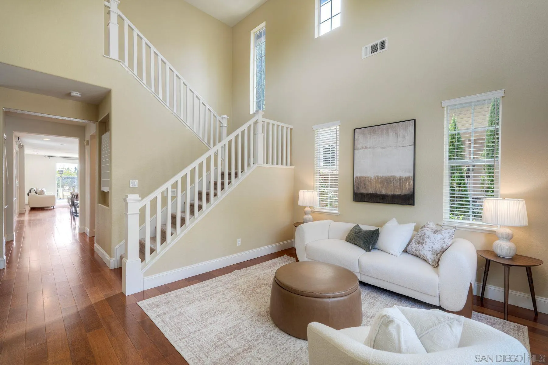 1614 Reflection Street San Marcos, CA 92078 - Photo 11 of 40 a living room with furniture and a wooden floor