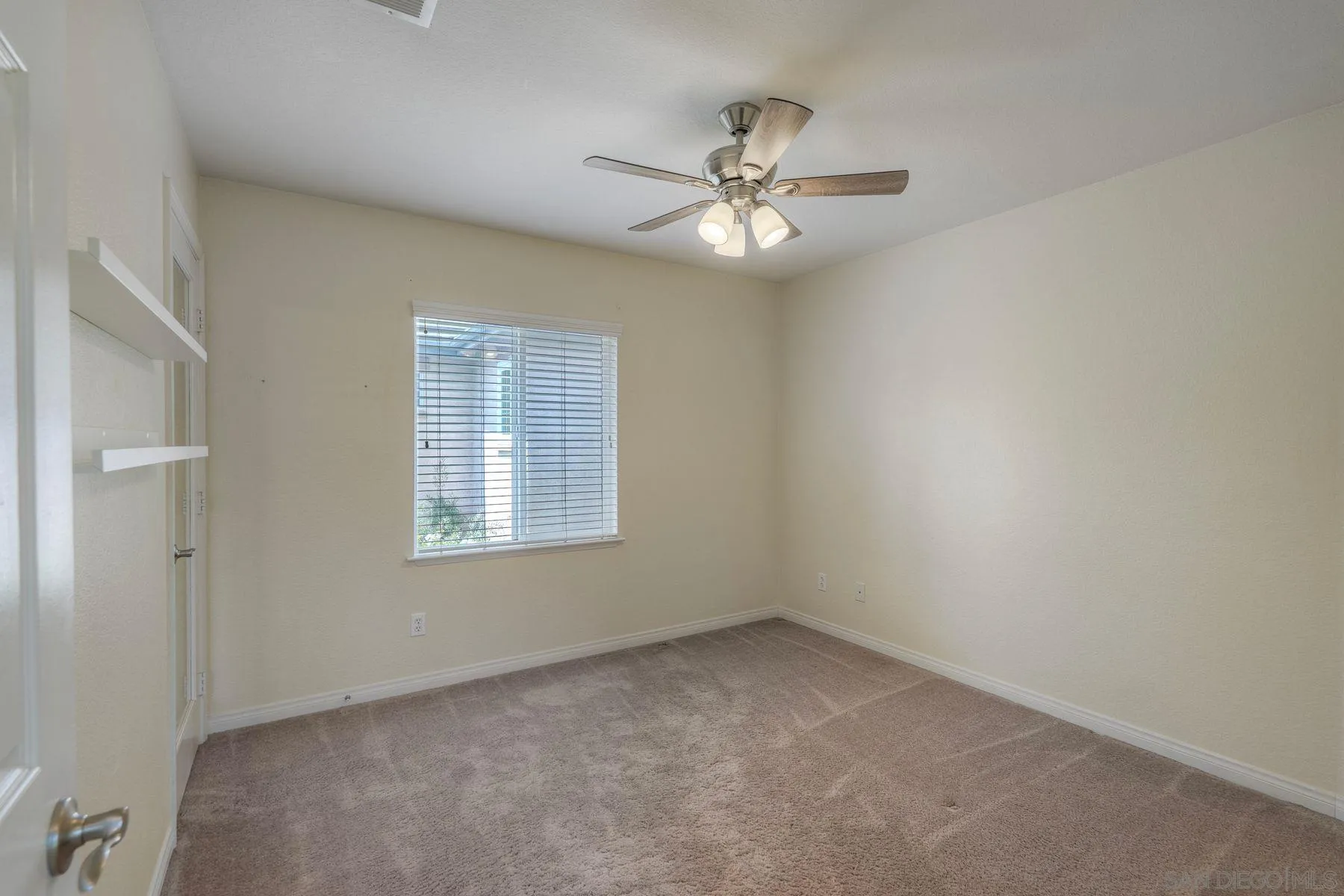 1614 Reflection Street San Marcos, CA 92078 - Photo 25 of 40 a view of an empty room with a window