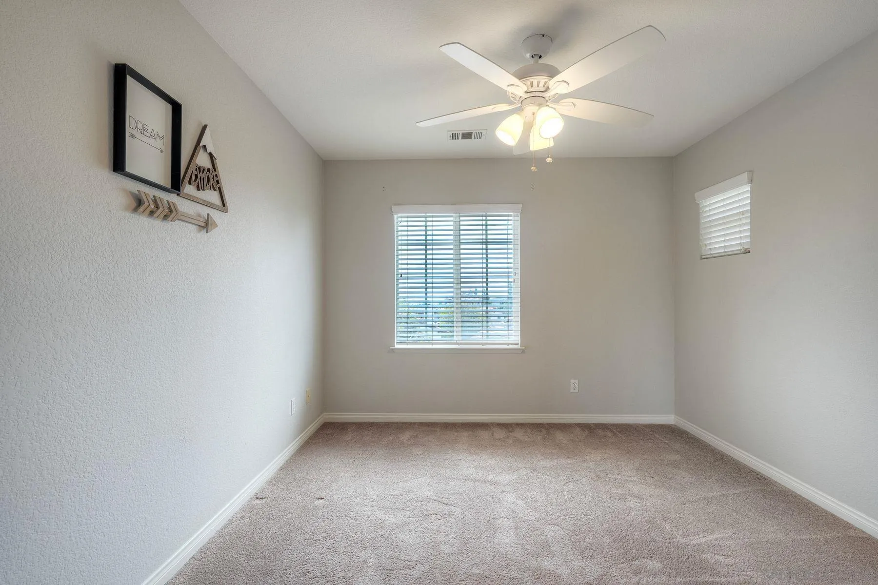 1614 Reflection Street San Marcos, CA 92078 - Photo 28 of 40 an empty room with windows and fan