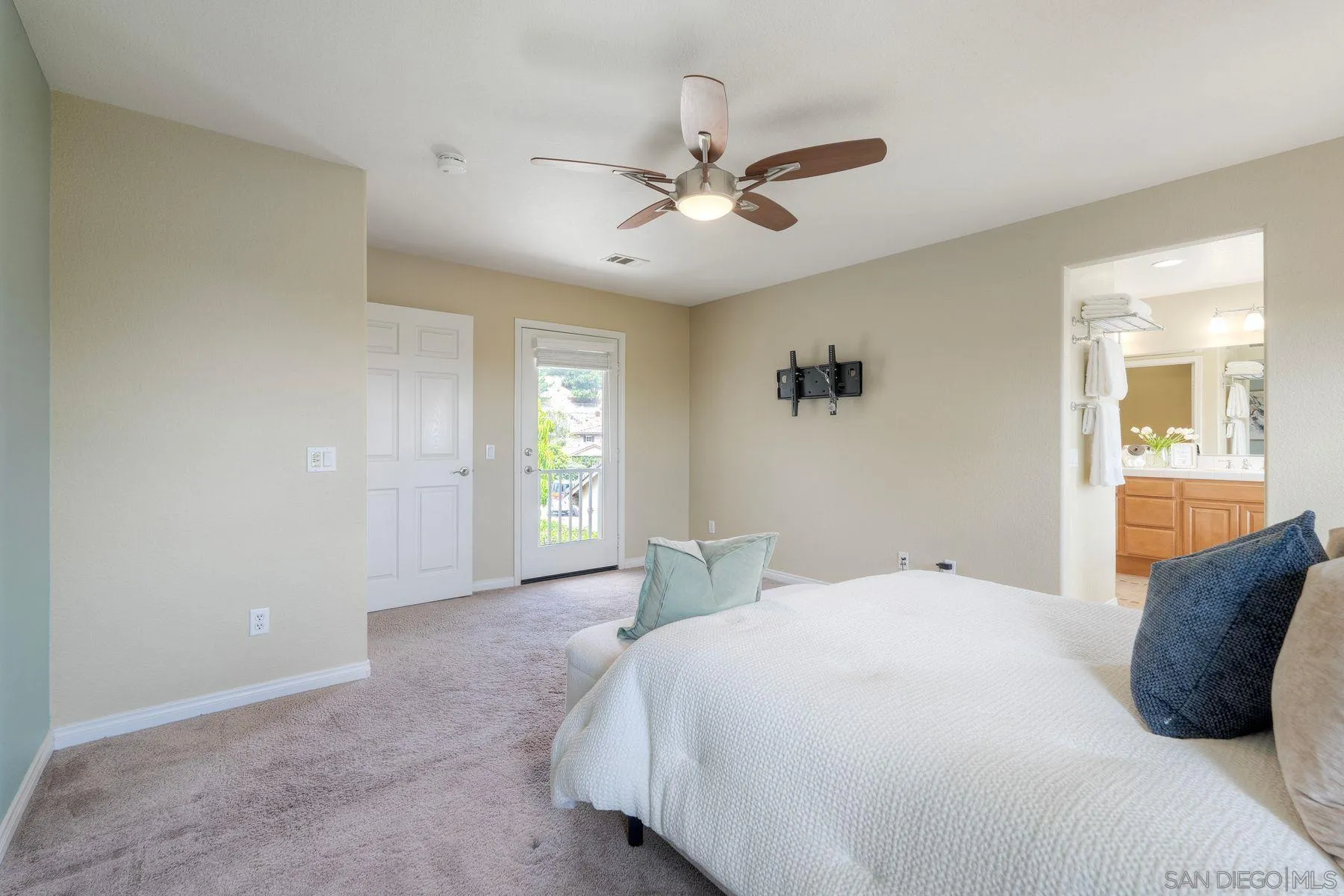 1614 Reflection Street San Marcos, CA 92078 - Photo 31 of 40 a bedroom with a large bed and a chandelier fan