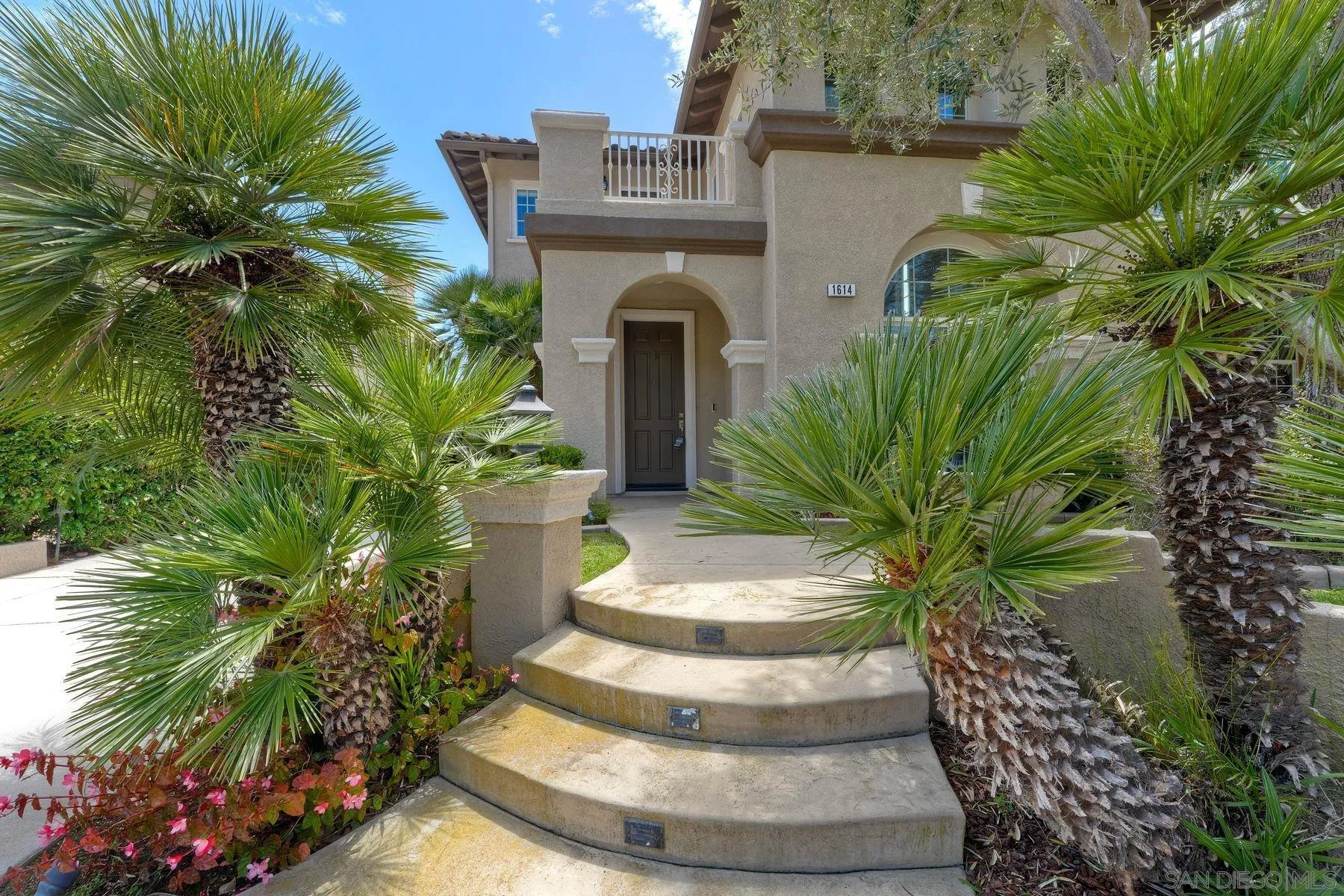 1614 Reflection Street San Marcos, CA 92078 - Photo 6 of 40 a front view of a house with a yard