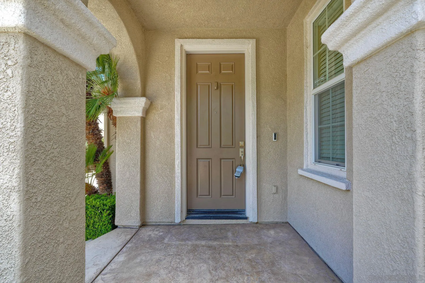 1614 Reflection Street San Marcos, CA 92078 - Photo 7 of 40 a view of a front door of the house