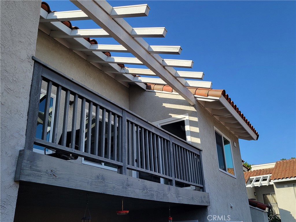 a view of balcony with wooden floor