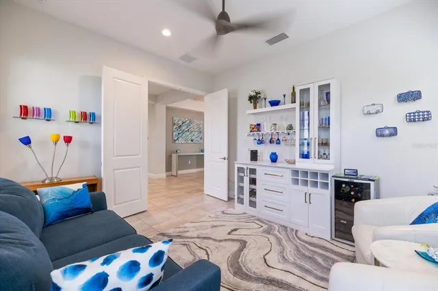 a living room with furniture and a large window