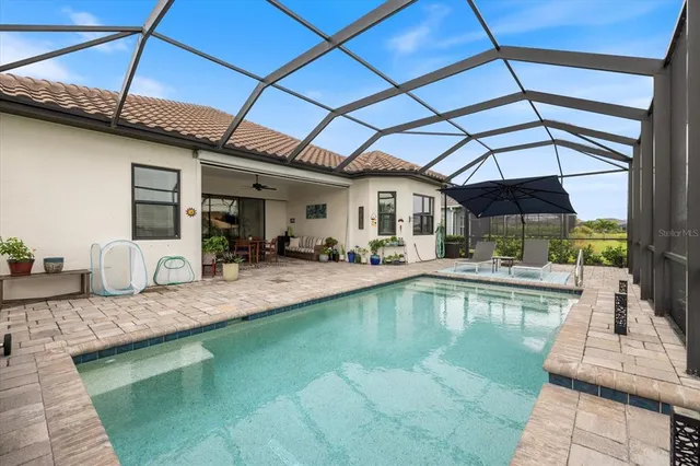 a spacious bedroom with a bed and ceiling fan