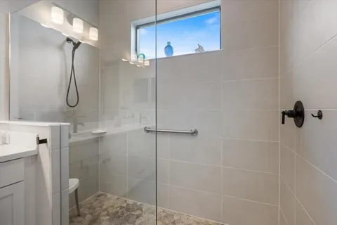 a bedroom with furniture and a flat screen tv