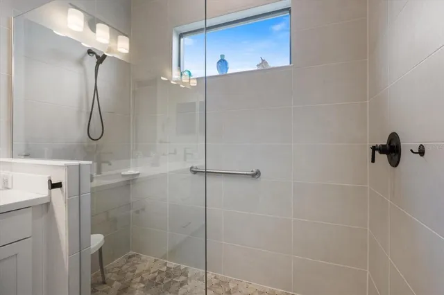 a bedroom with furniture and a flat screen tv