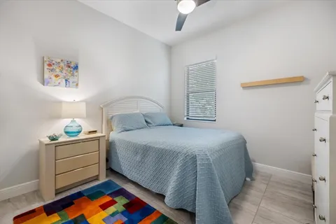 a house with potted plants in front of door