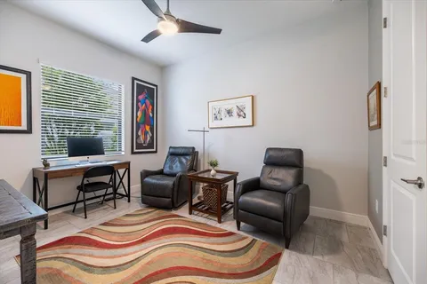 an aerial view of ocean and residential houses with outdoor space