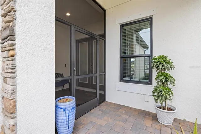 a living room with furniture dining table a window and appliances
