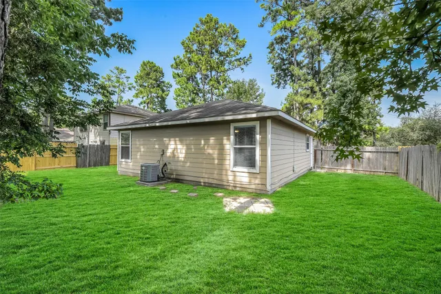 a backyard of a house with lots of green space