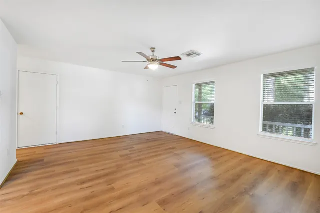 a view of an empty room with a window