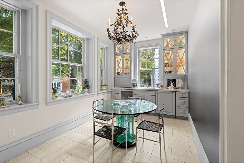 38 Chestnut Street Salem, MA 01970 - Photo 15 of 41 a dining room with chandelier and wooden floor