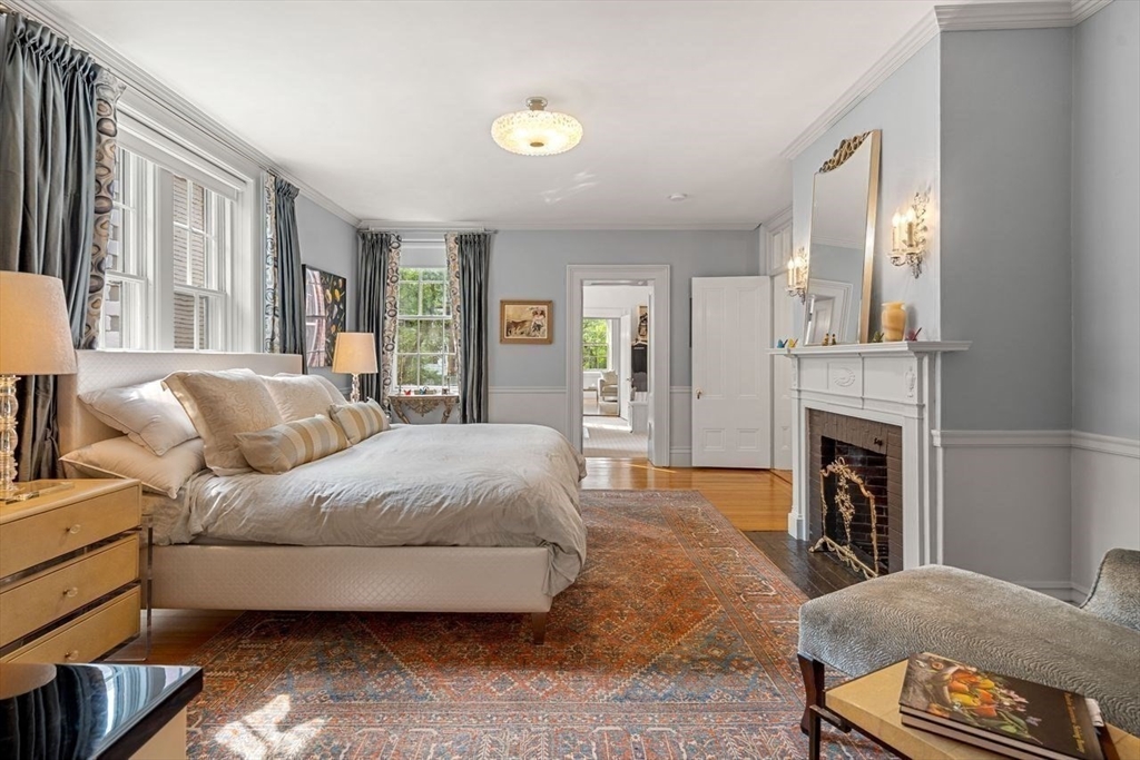 38 Chestnut Street Salem, MA 01970 - Photo 19 of 41 a spacious bedroom with a bed and a fireplace