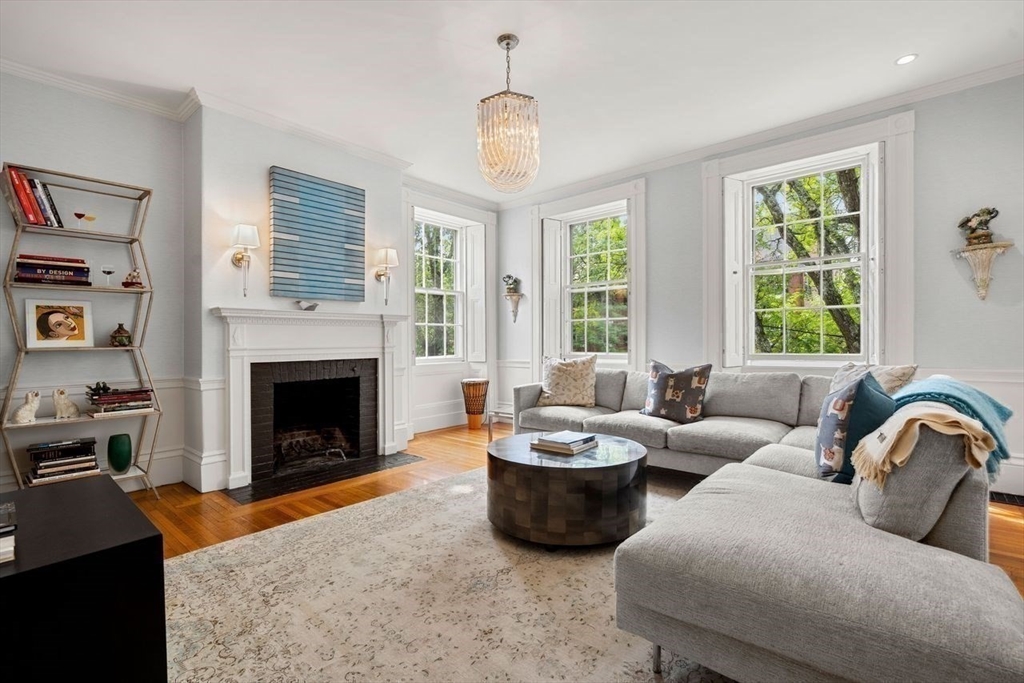 38 Chestnut Street Salem, MA 01970 - Photo 23 of 41 a living room with furniture a fireplace and a window