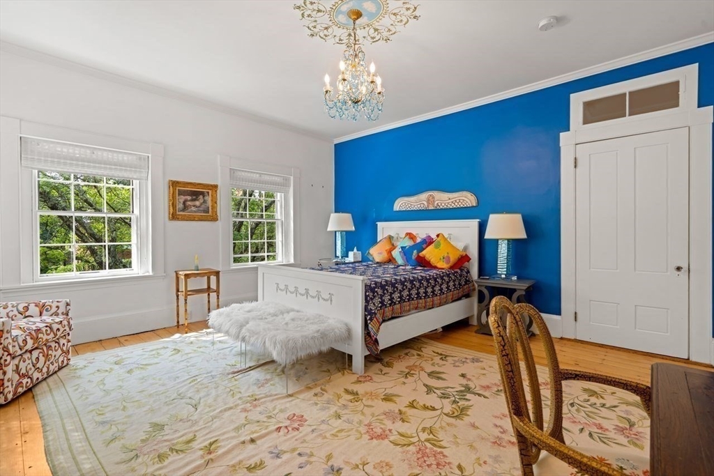 38 Chestnut Street Salem, MA 01970 - Photo 31 of 41 a bedroom with a bed a dresser and a window