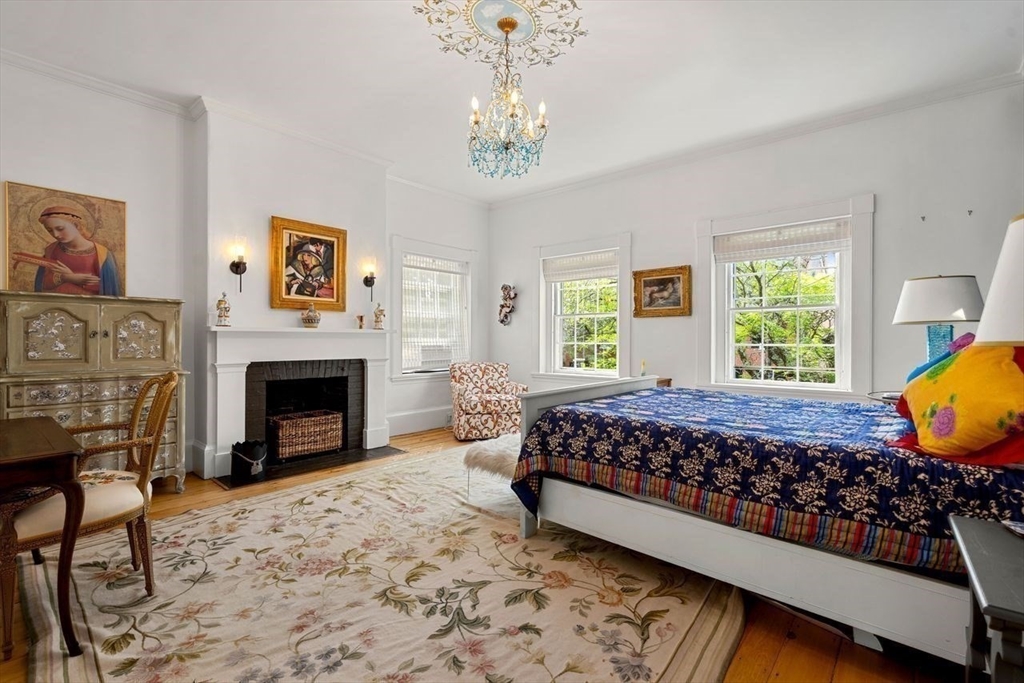 38 Chestnut Street Salem, MA 01970 - Photo 32 of 41 a bed room with a bed and a fireplace