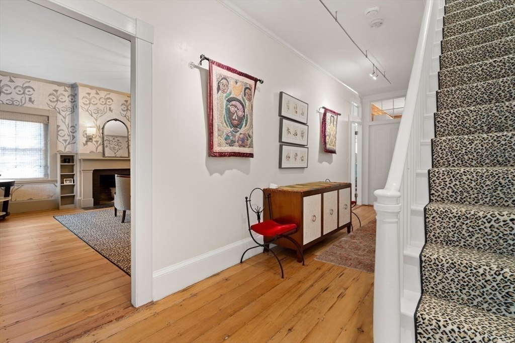 38 Chestnut Street Salem, MA 01970 - Photo 33 of 41 a living room with furniture and a fireplace