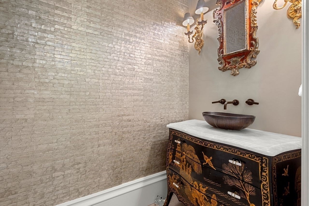 38 Chestnut Street Salem, MA 01970 - Photo 7 of 41 a bathroom with a sink a light fixture and a toilet