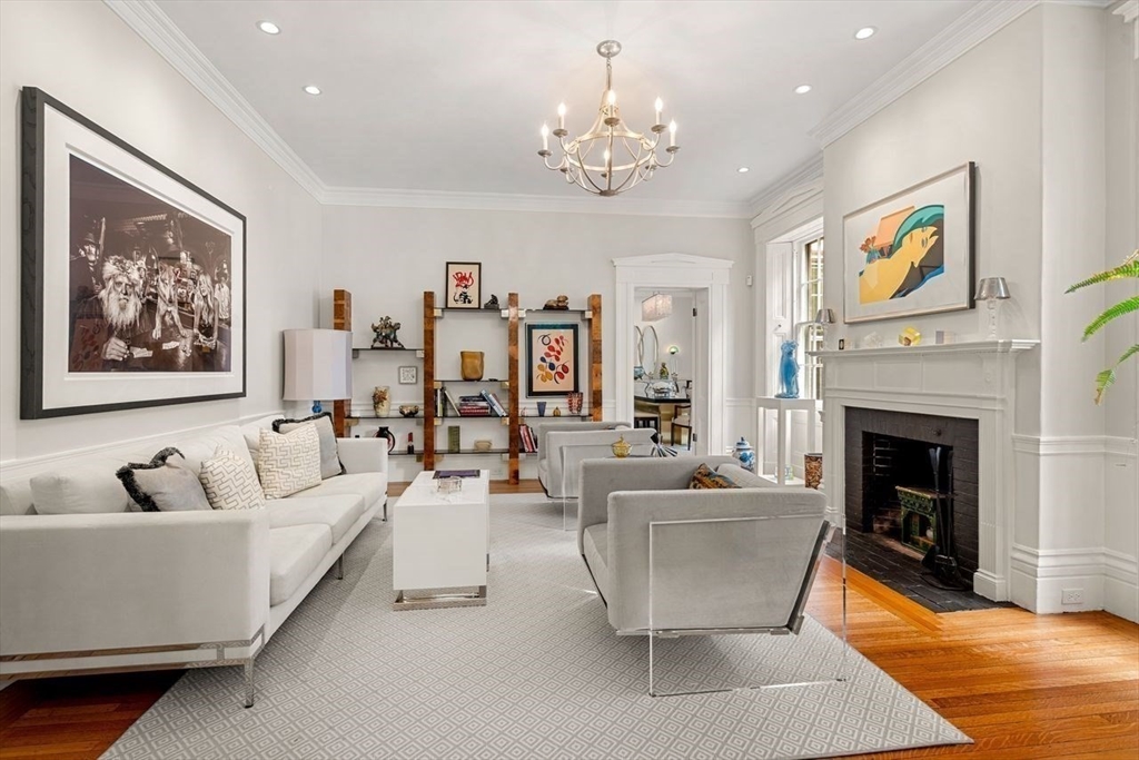 38 Chestnut Street Salem, MA 01970 - Photo 8 of 41 a living room with furniture a chandelier and a fireplace
