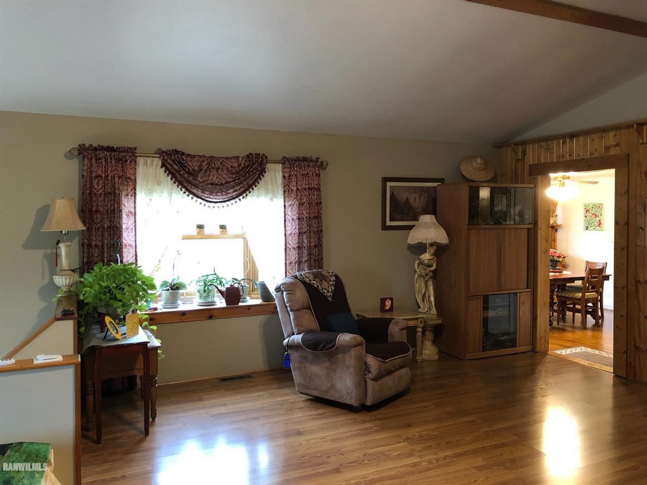 5392 East Maize Road Ridott, IL 61067 - Photo 4 of 25 a living room with furniture and a large window