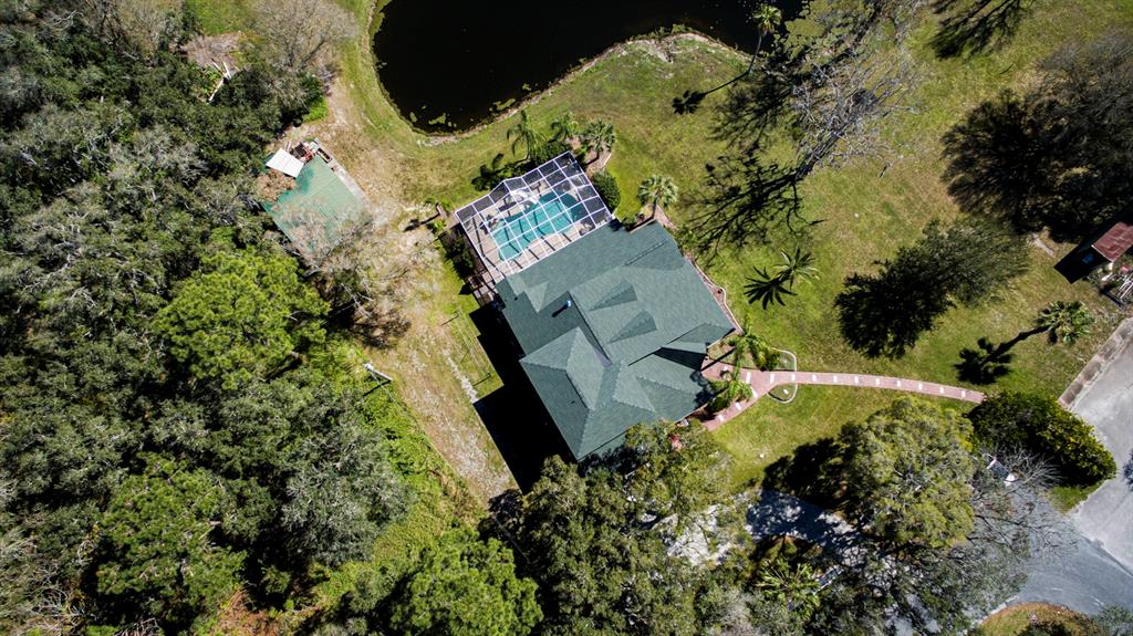 9215 Ridge Road New Port Richey, FL 34654 - Photo 14 of 71 an aerial view of a residential houses with yard