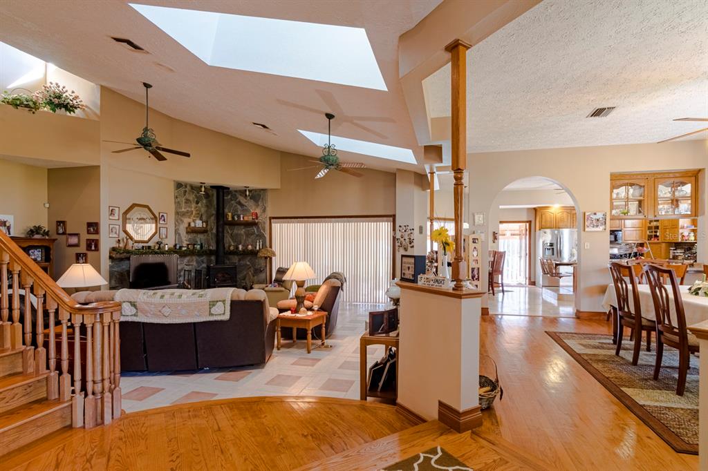 9215 Ridge Road New Port Richey, FL 34654 - Photo 17 of 71 a living room with lots of furniture and kitchen view