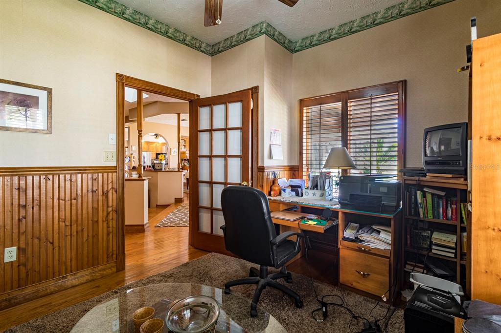9215 Ridge Road New Port Richey, FL 34654 - Photo 20 of 71 a view of a workspace with furniture and a window